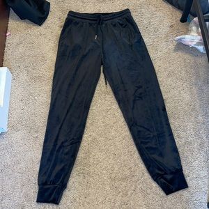 Black velvet joggers.
